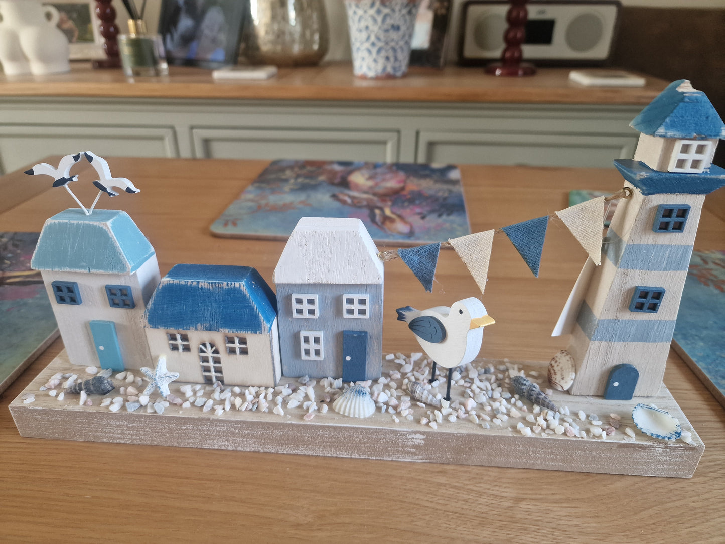 Harbourside Scene with Lighthouse and Cottages