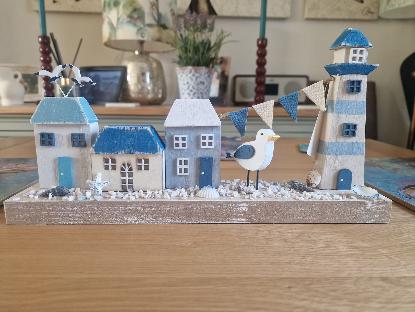 Harbourside Scene with Lighthouse and Cottages