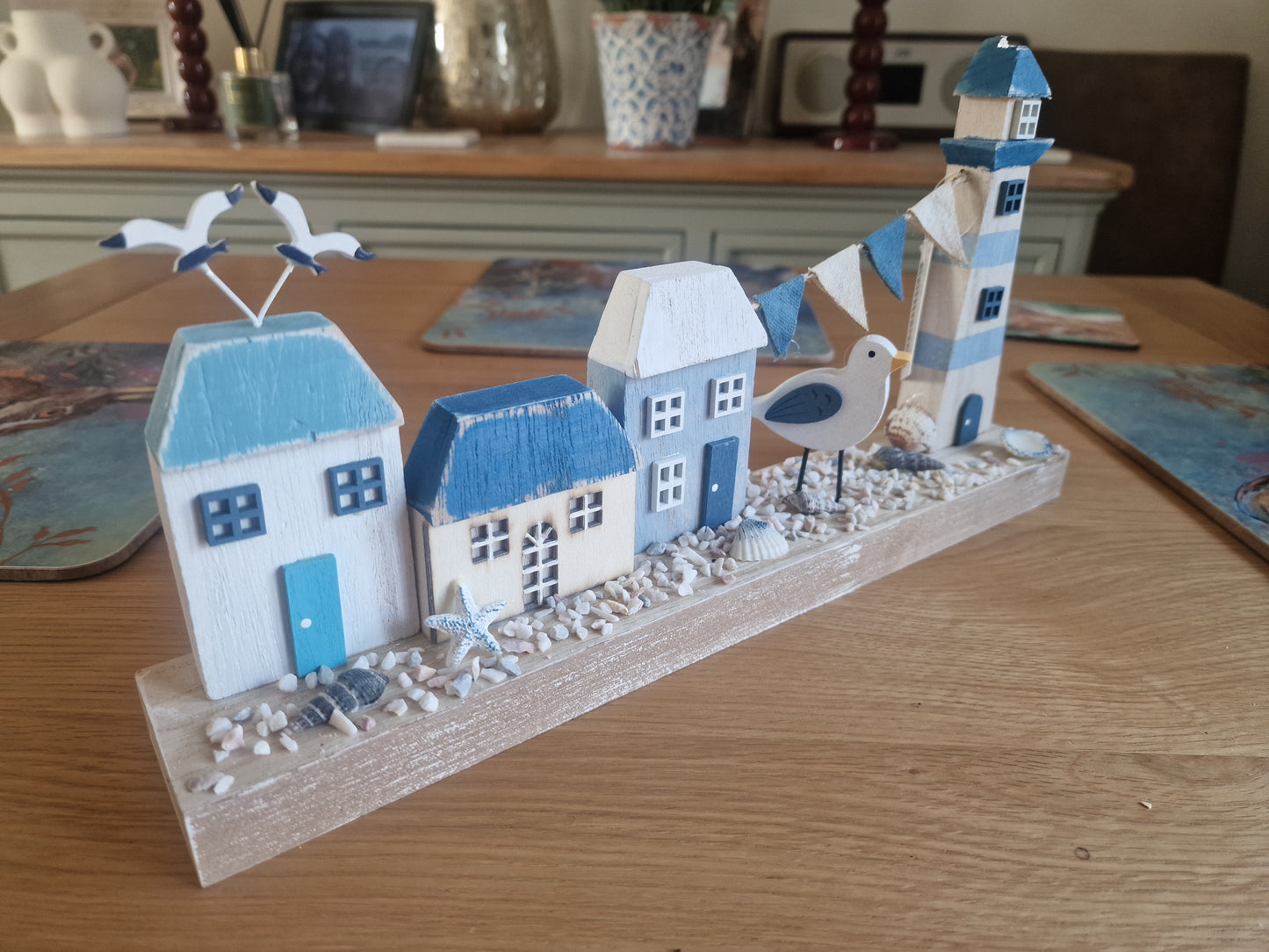 Harbourside Scene with Lighthouse and Cottages