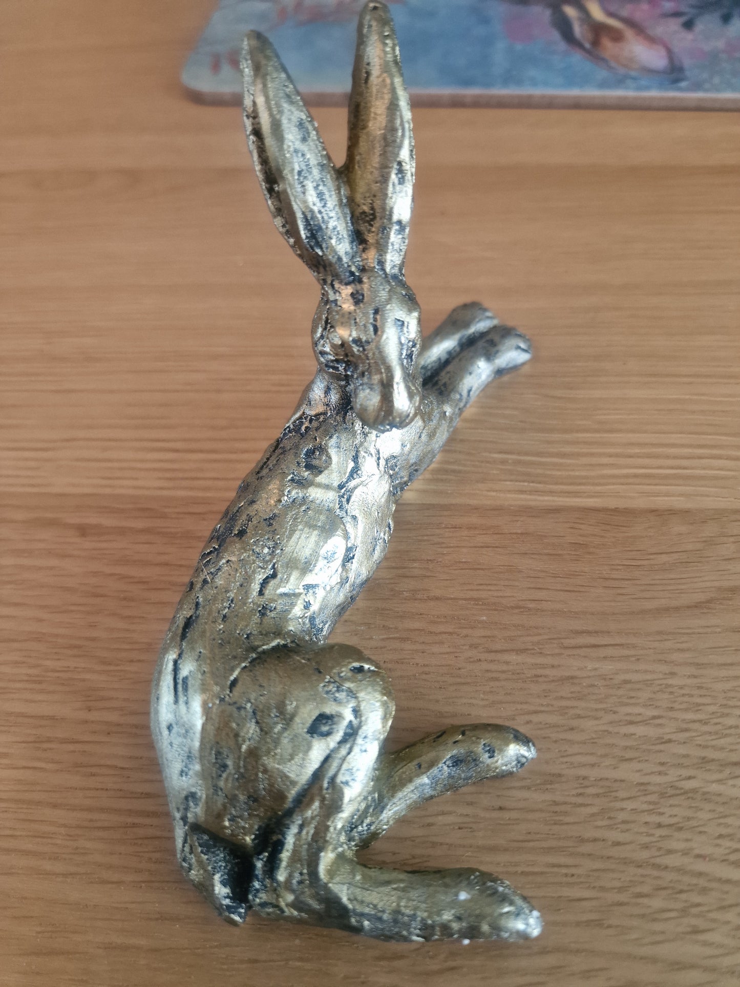 Lounging Hare Bronze Finish Sculpture . H10cm