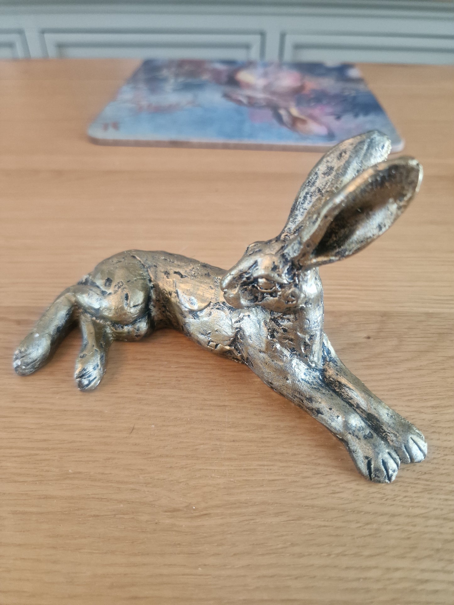 Lounging Hare Bronze Finish Sculpture . H10cm